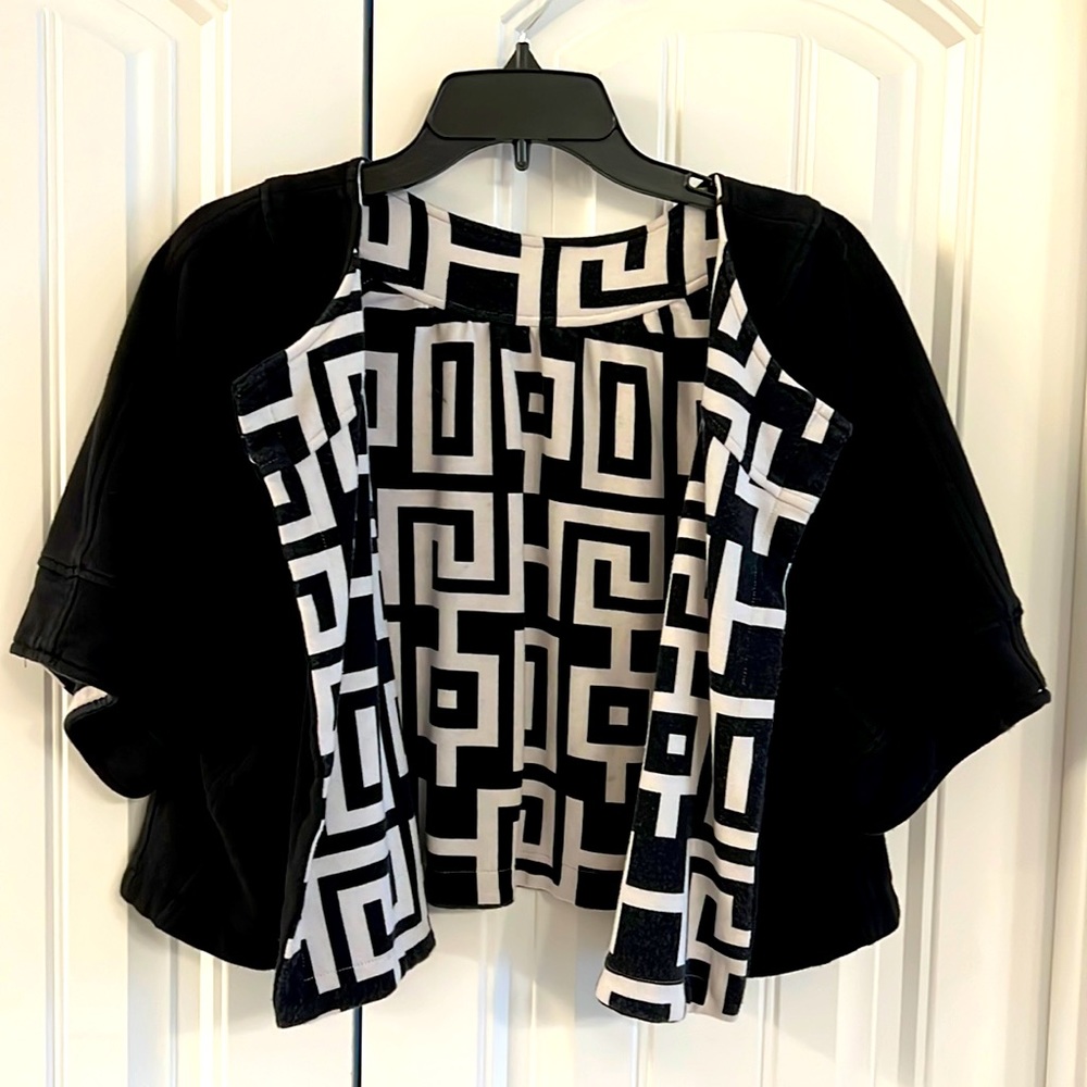 Reversible black to geo print flare jacket